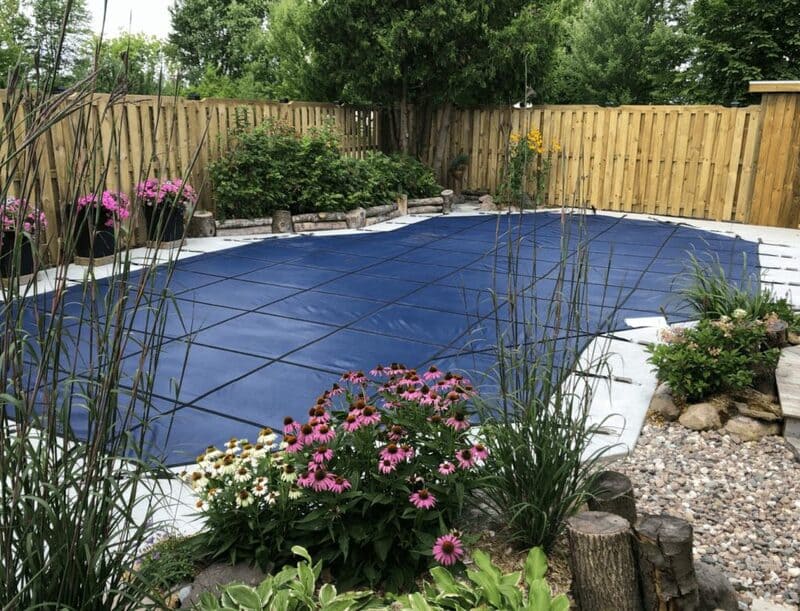 Adding a pool safety cover is an important part of closing your inground pool for winter.