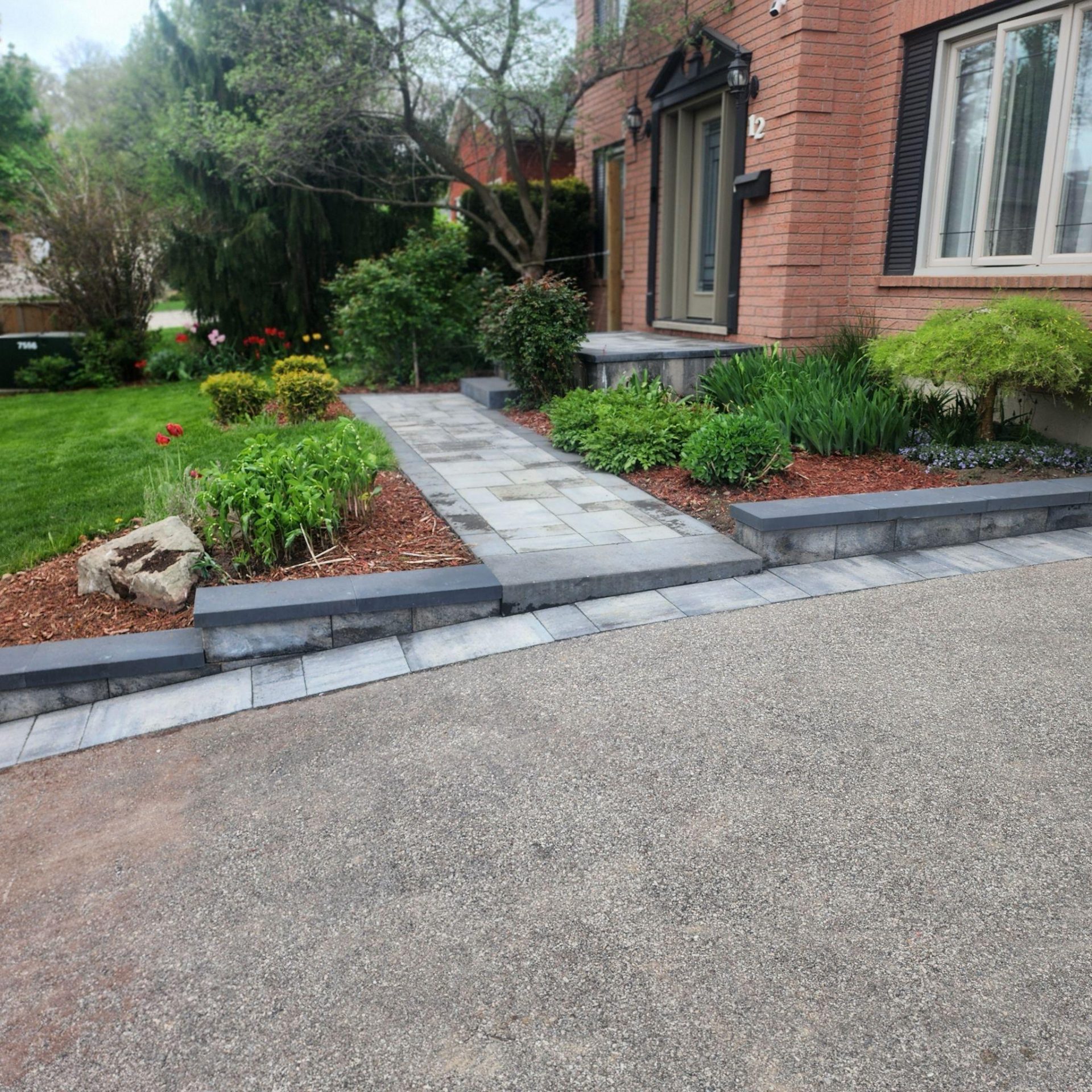 Front entrance landscaping with stone pathway